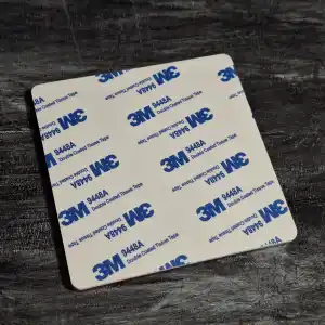The adhesive sticker backing on the reverse of the acrylic tag