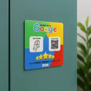The complete Google Review acrylic tag adhered to a vertical teal cabinet face with its tap and scan panels visible